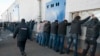 "Нас держали в участке несколько часов". Как полиция в России вербует мигрантов на войну против Украины